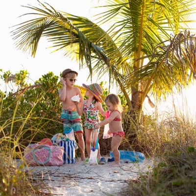 boy-and-two-sisters-collecting-seashells-at-beach-2022-03-07-23-57-07-utc